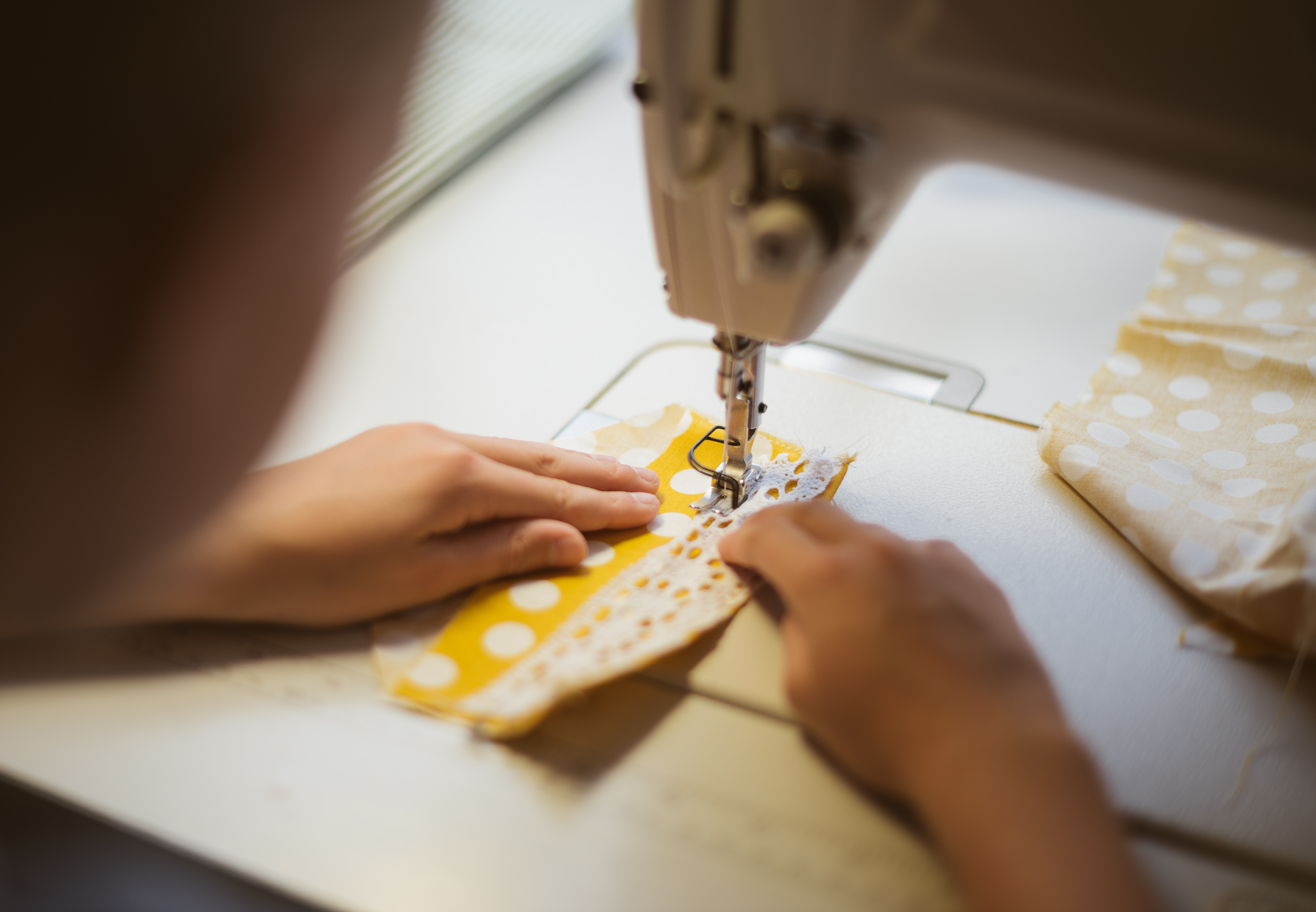 kids hands sewing machine