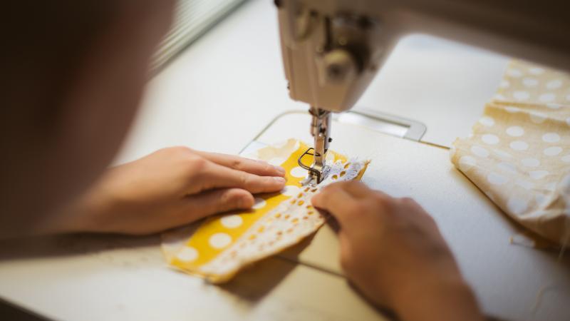 kids hands sewing machine