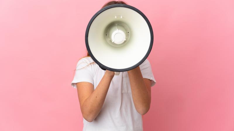 Girl holding microphone in front of face